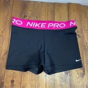 Nike pro size large black shorts with pink waistband